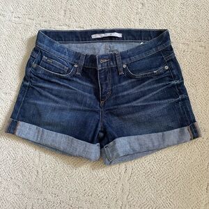 Darker wash jean shorts with rolled stitched hem